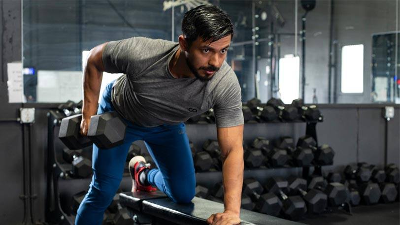 A man lifting weights in a weight room